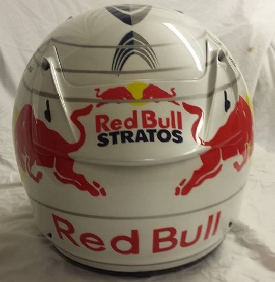 Airbrushed Painting of a White Custom Helmet with Red Bull design close up